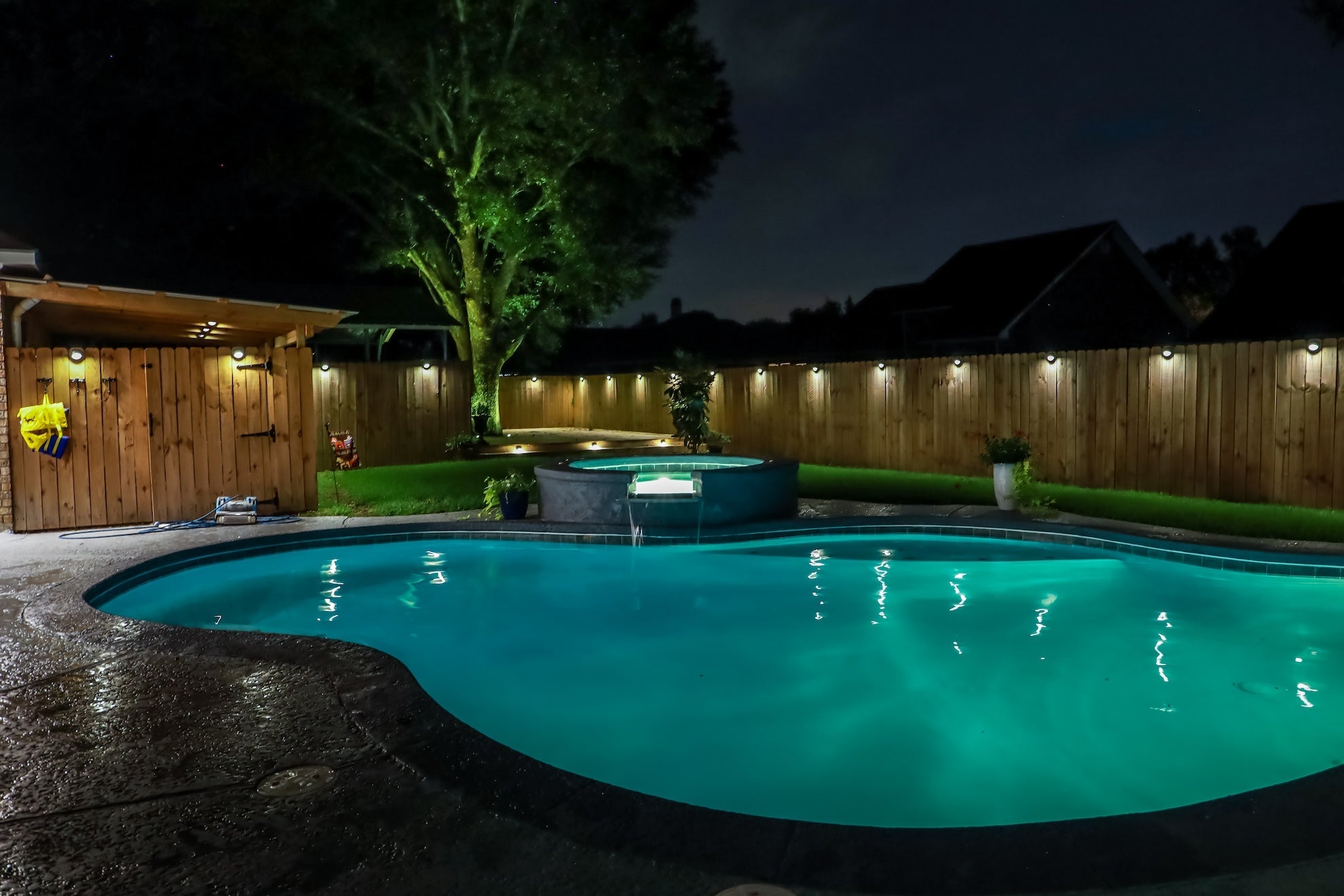 beautiful nightime backyard pool view